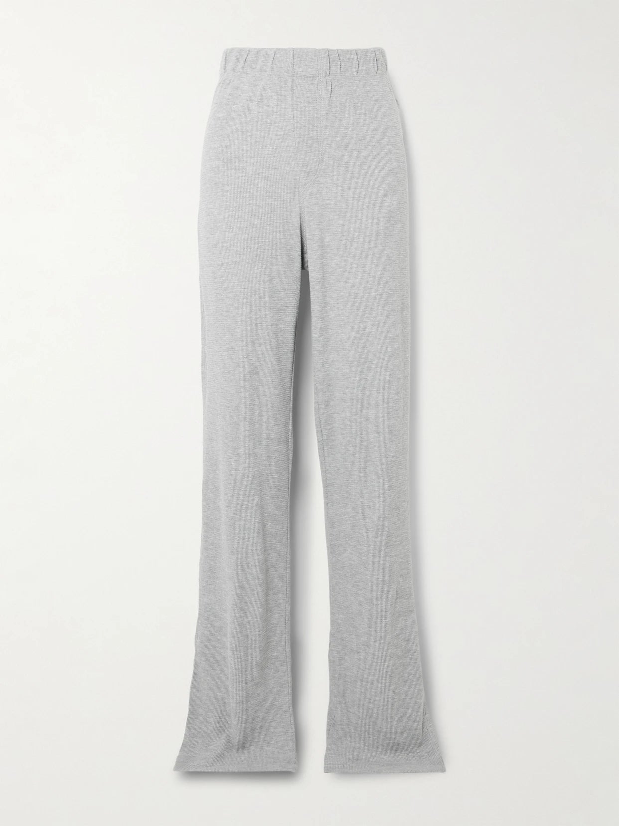 Image of a model wearing Tops. Product name - Waffle-knit Jersey Track Pants in Light gray colour by brand - ÉTERNE