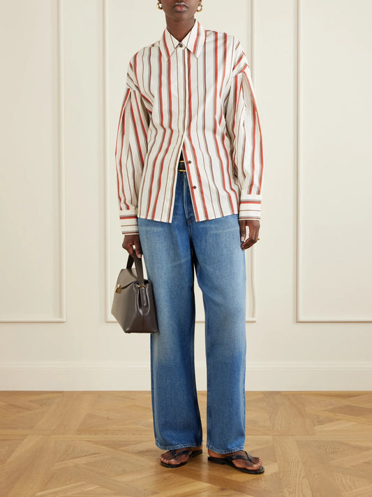 Image of a model wearing Tops. Product name - Alva Striped Cotton-poplin Shirt in Cream colour by brand - SIR.