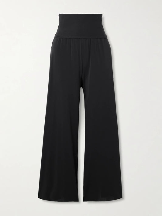 Image of a model wearing Pants. Product name - Les Essentiels Dao Convertible Wide-leg Pants in Black colour by brand - Eres