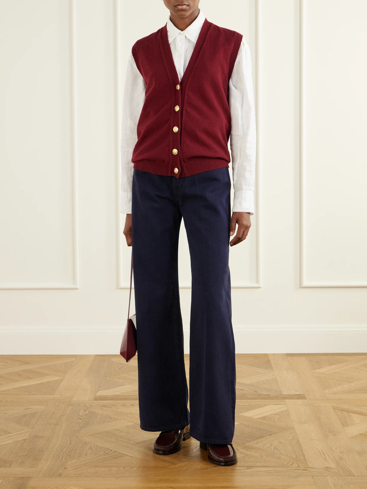 Image of a model wearing Outerwear. Product name - Highland Wool And Cashmere-blend Vest in Burgundy colour by brand - BLAZÉ Milano