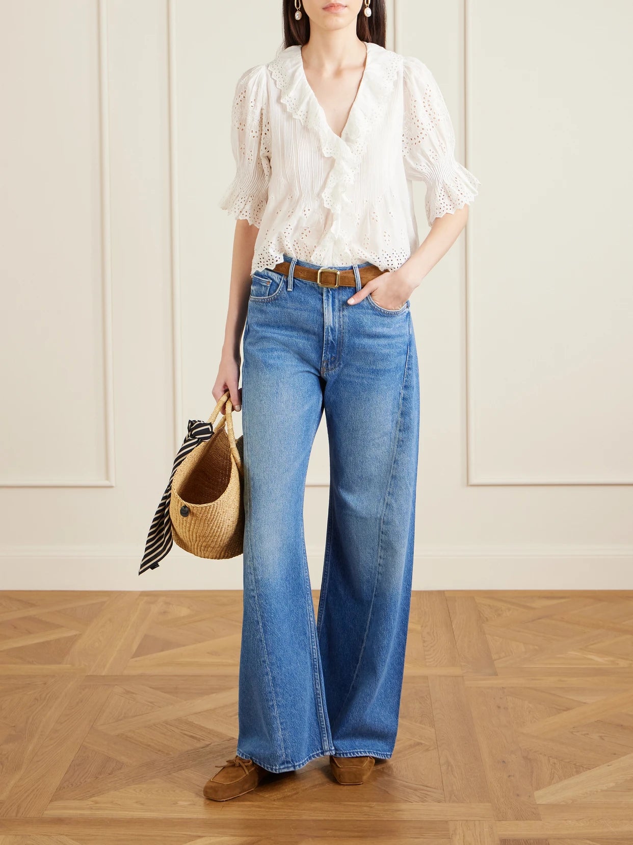 Image of a model wearing Tops. Product name - Henri Ruffled Pintucked Broderie Anglaise Cotton Top in White colour by brand - DÔEN
