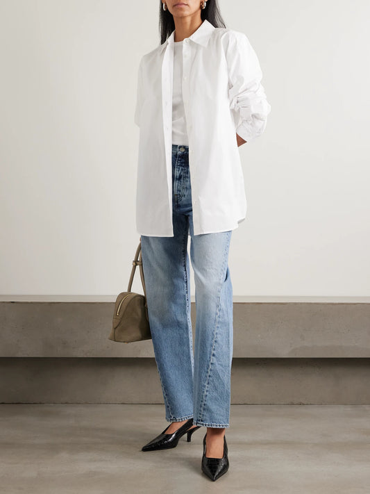 Image of a model wearing Tops. Product name - Garderob Organic Cotton-poplin Shirt in White colour by brand - TOTEME