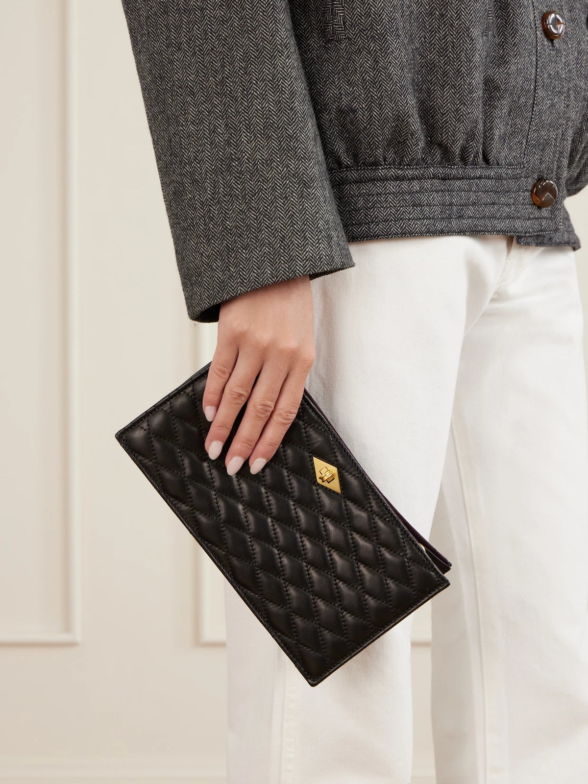 Image of Bags. Product name - Ease Quilted Leather Clutch in Black colour by brand - Métier