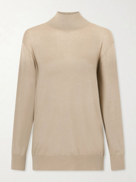 Image of a model wearing Outerwear. Product name - Orly Cashmere And Silk-blend Turtleneck Sweater in Taupe colour by brand - The Row