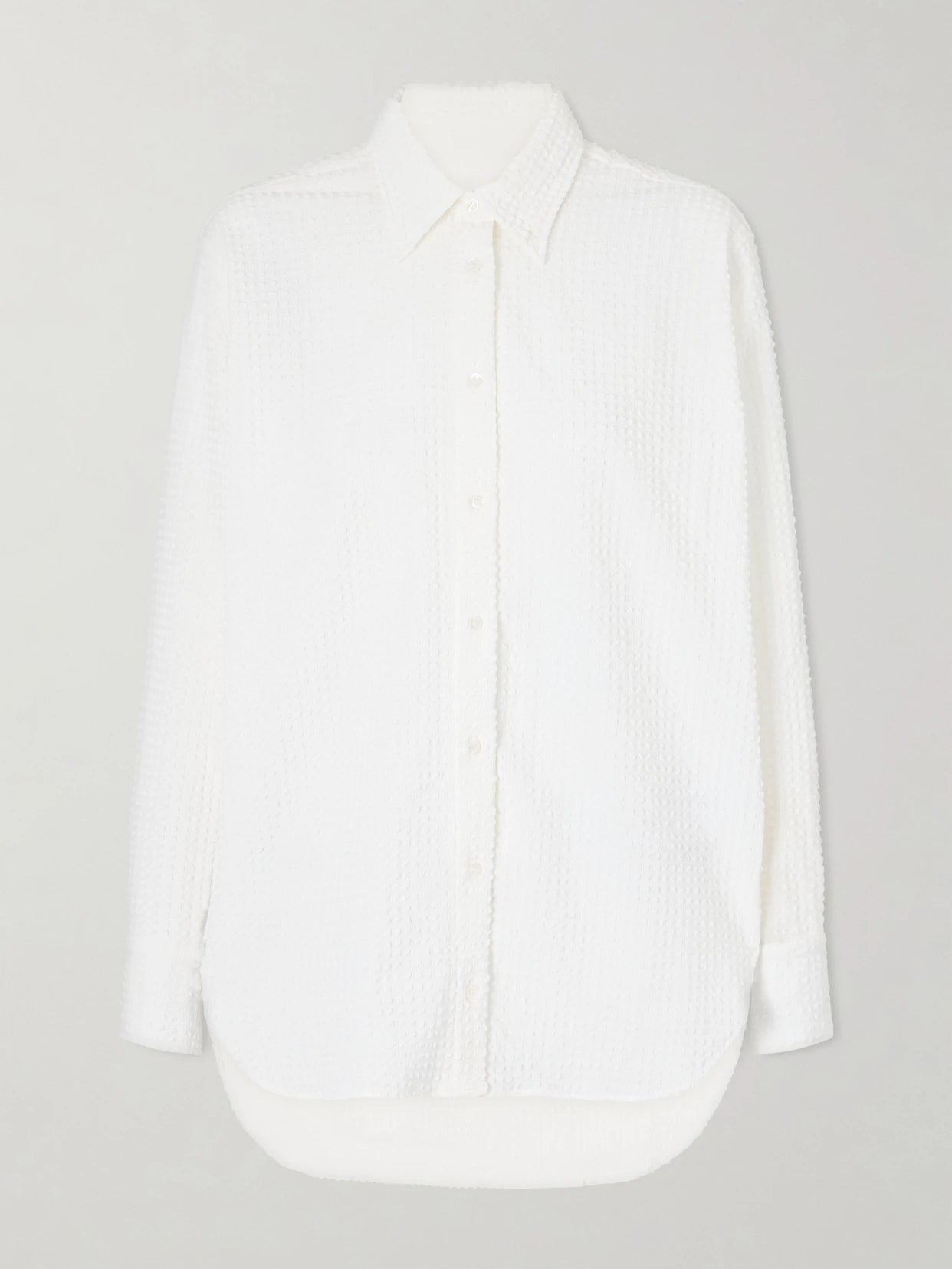 Image of a model wearing Tops. Product name - Seersucker Shirt in White colour by brand - Hunza G