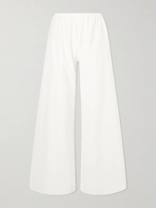 Image of a model wearing Pants. Product name - Colby Cotton-poplin Wide-leg Pants in White colour by brand - La Ligne