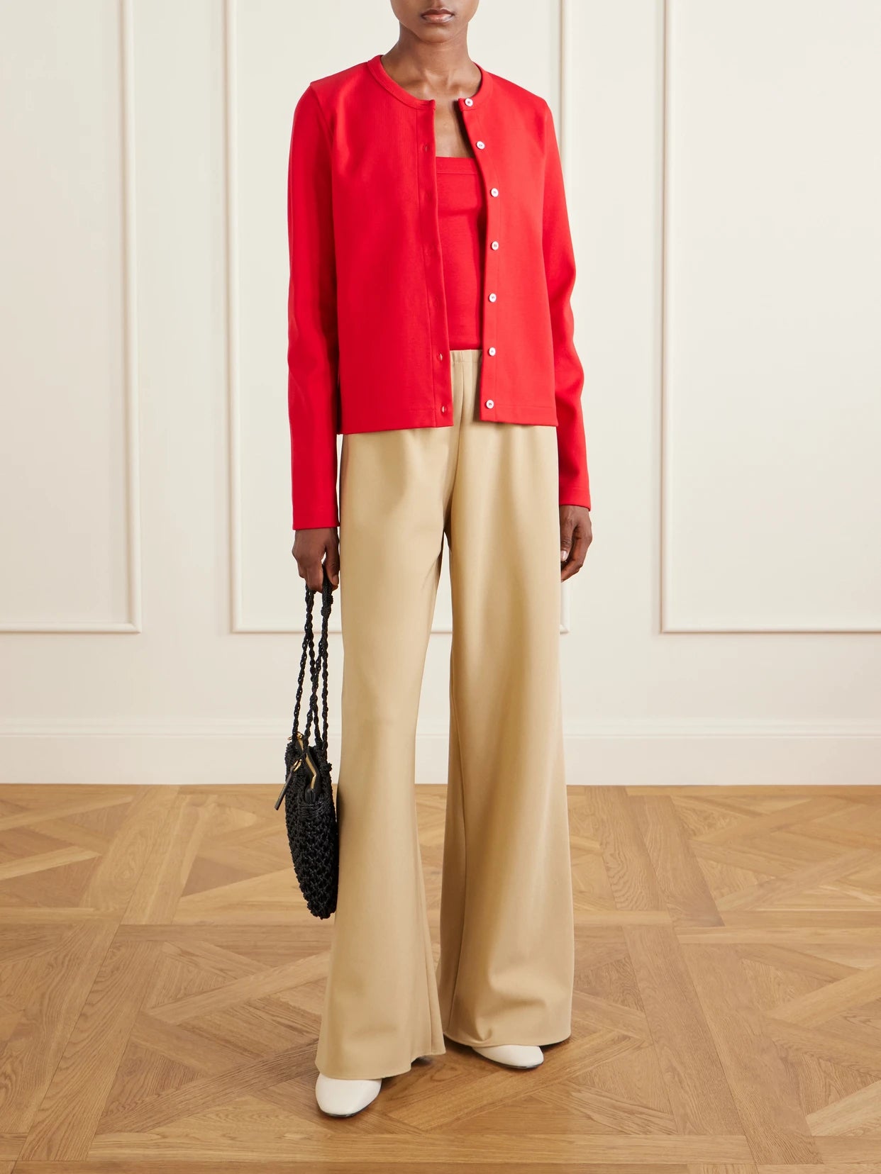 Image of a model wearing Outerwear. Product name - Poppy Organic Cotton-jersey Cardigan in Red colour by brand - FLORE FLORE