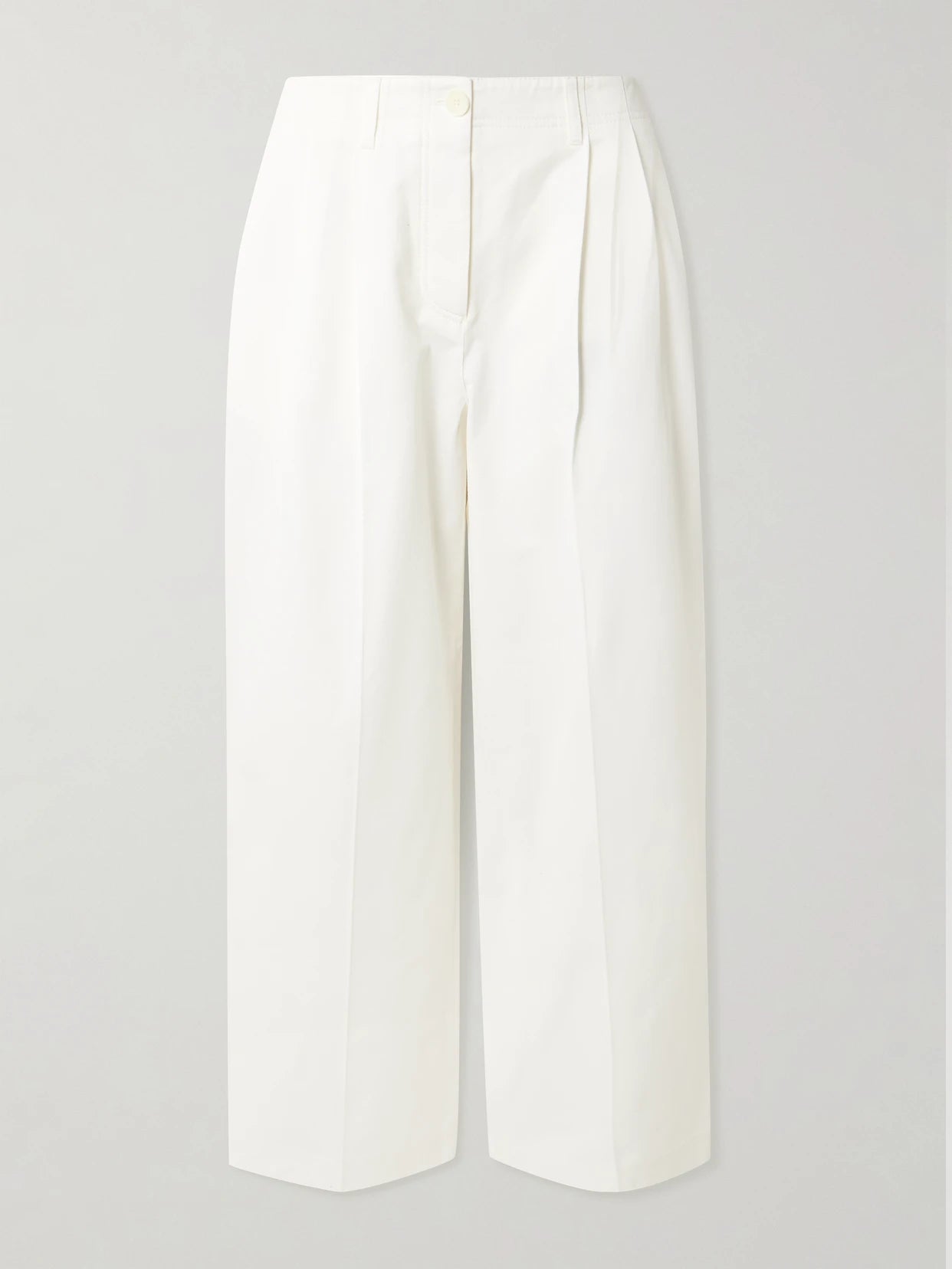 Image of a model wearing Pants. Product name - Pleated Cotton-twill Wide-leg Pants in White colour by brand - TOTEME