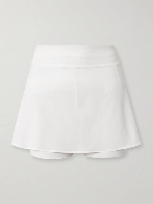 Image of a model wearing Skirts. Product name - Lightweight Tennis Stretch Skirt in White colour by brand - lululemon