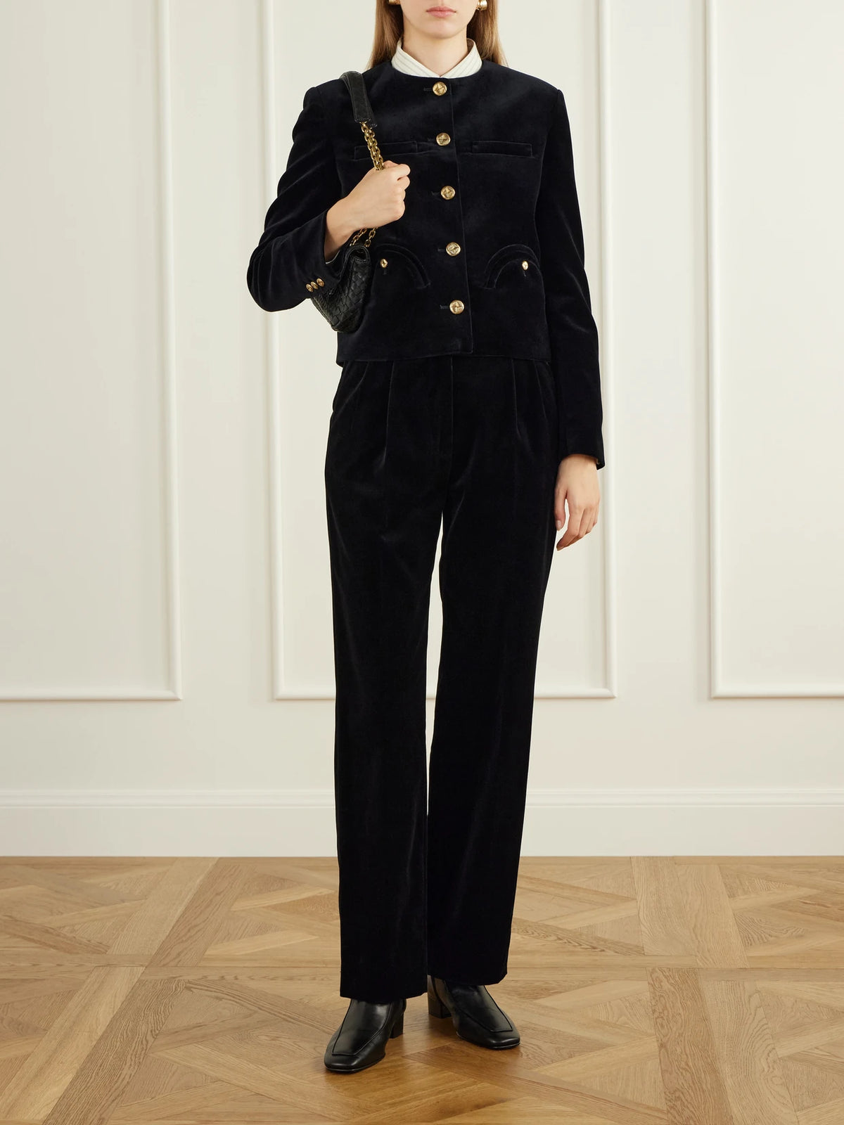 Image of a model wearing Pants. Product name - Fox Straight-leg Cotton-velvet Pants in Black colour by brand - BLAZÉ Milano