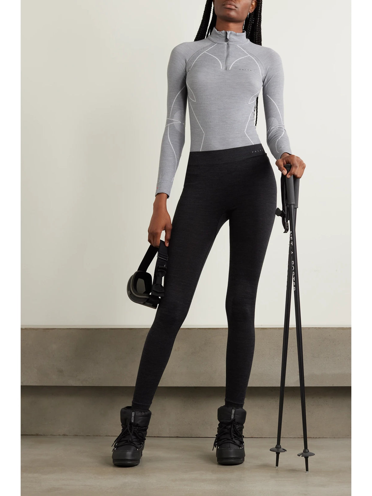 Image of a model wearing Pants. Product name - Technical Stretch Wool-blend Leggings in Black colour by brand - FALKE Ergonomic Sport System