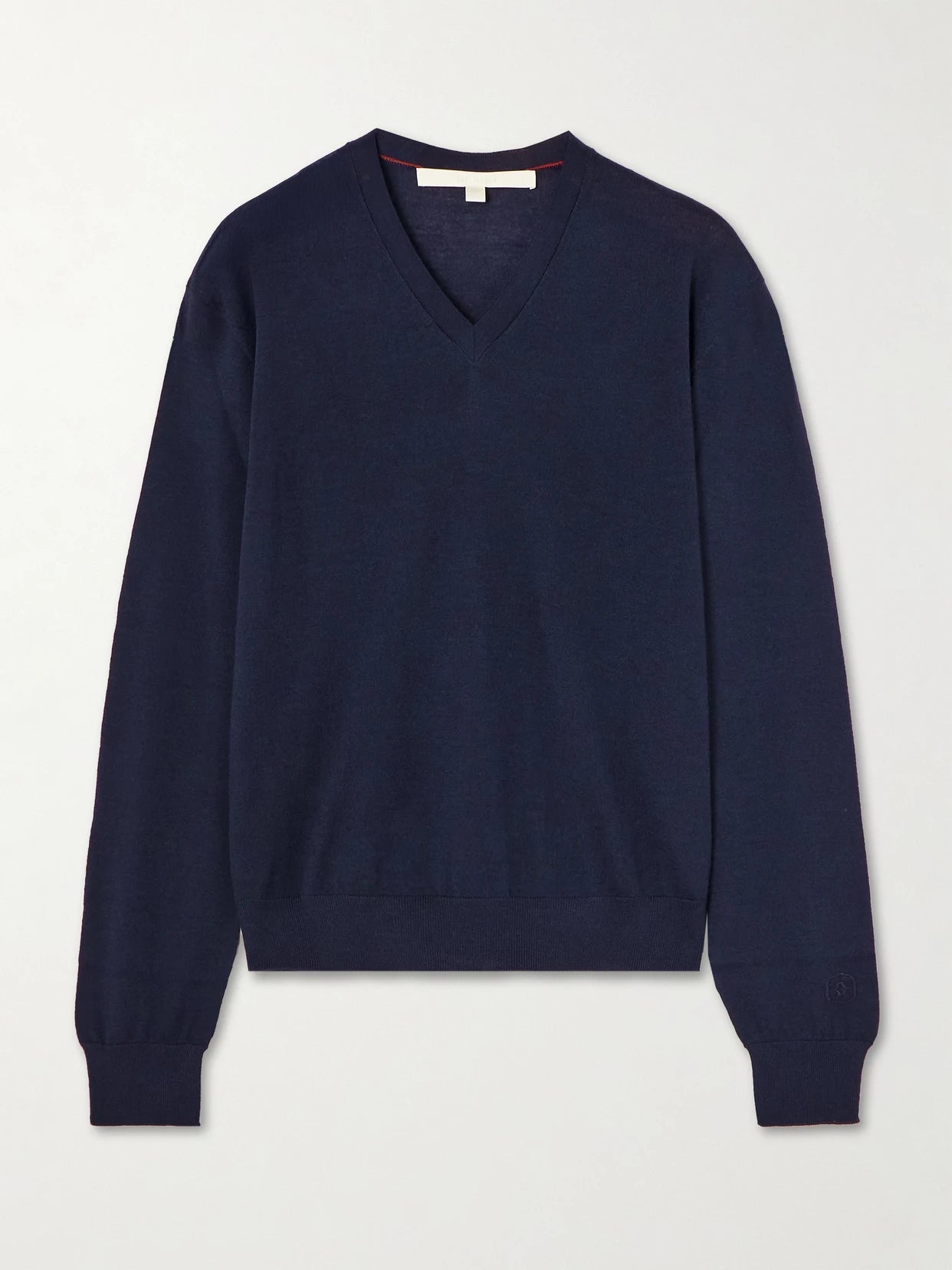 Image of a model wearing Outerwear. Product name - Oscar Embroidered Merino Wool Sweater in Navy colour by brand - RÙADH