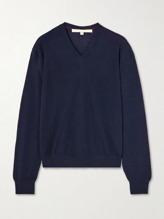 Image of a model wearing Outerwear. Product name - Oscar Embroidered Merino Wool Sweater in Navy colour by brand - RÙADH