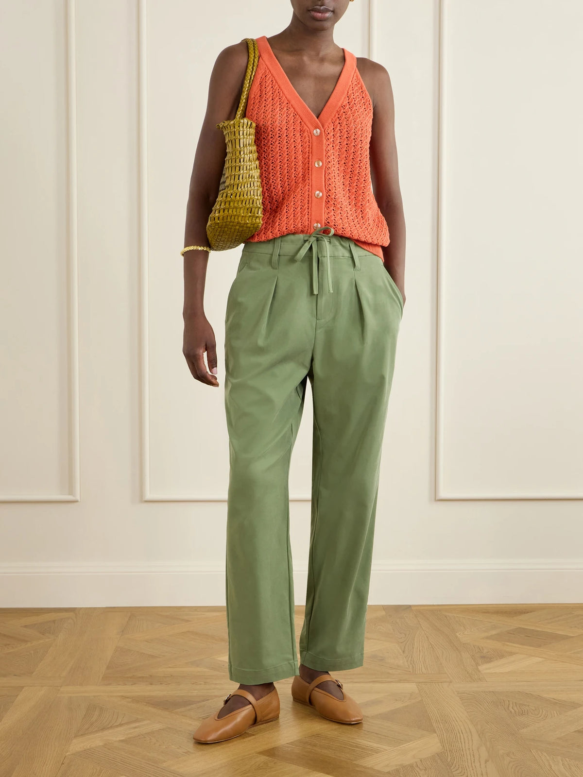 Image of a model wearing Pants. Product name - Hadleigh Twill Tapered Pants in Green colour by brand - Varley
