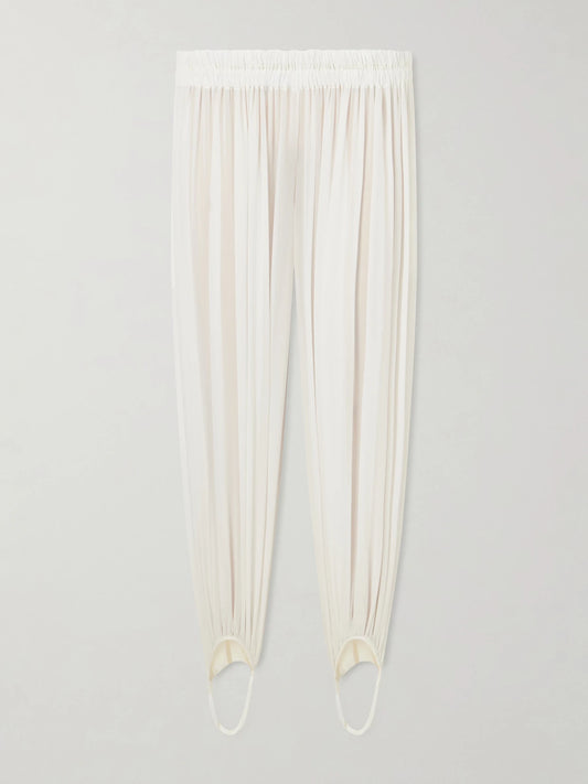 Image of a model wearing Pants. Product name - Shirred Silk-blend Georgette Balloon Pants in Off-white colour by brand - Alaïa