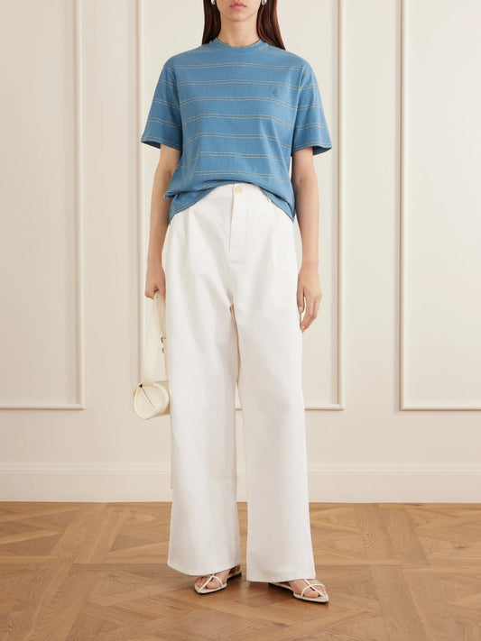 Image of a model wearing Tops. Product name - Logo-embossed Striped Cotton T-shirt in Blue colour by brand - Jil Sander