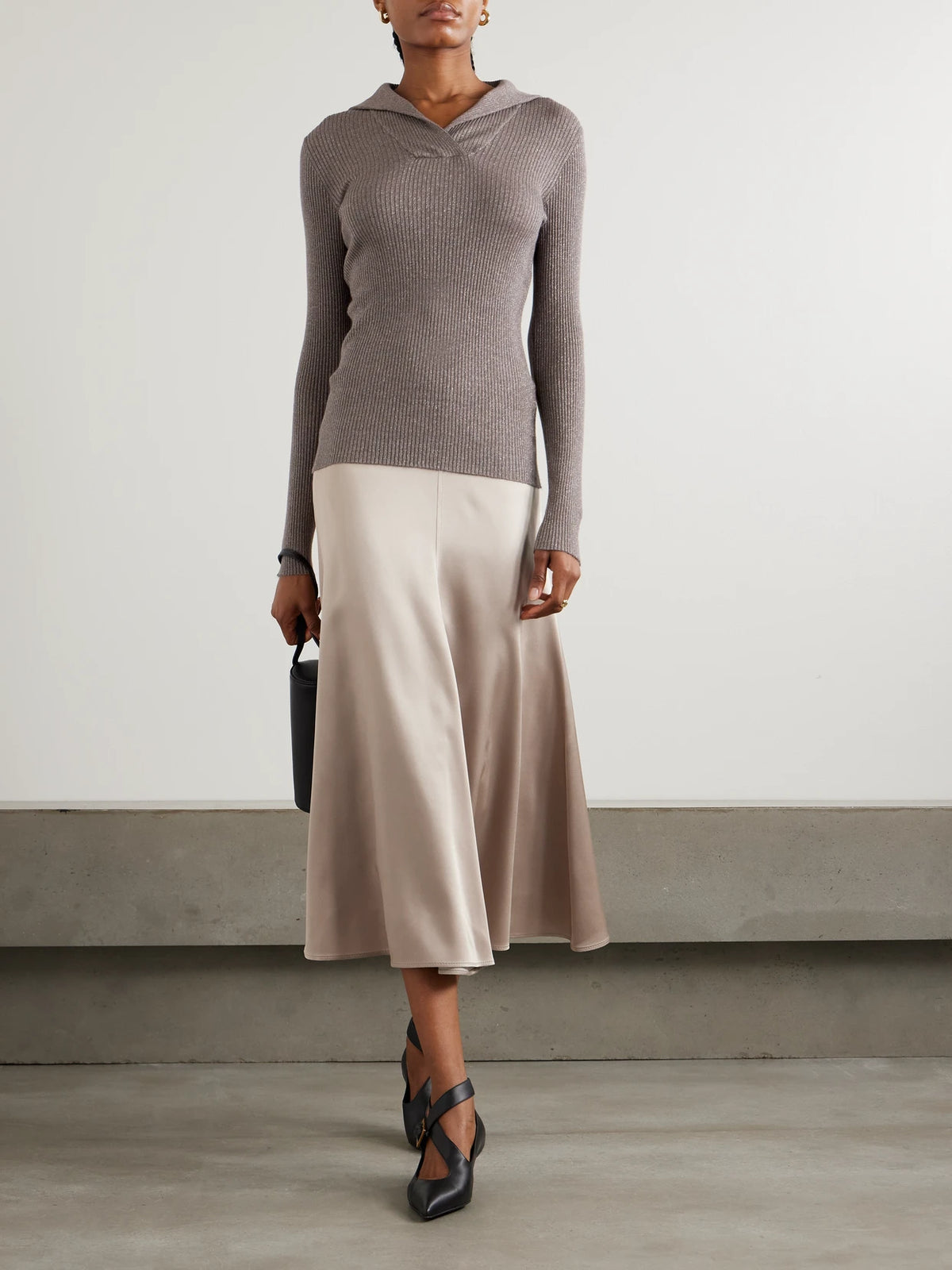 Image of a model wearing Outerwear. Product name - Ribbed Metallic Cashmere And Silk-blend Top in Dark brown colour by brand - Brunello Cucinelli