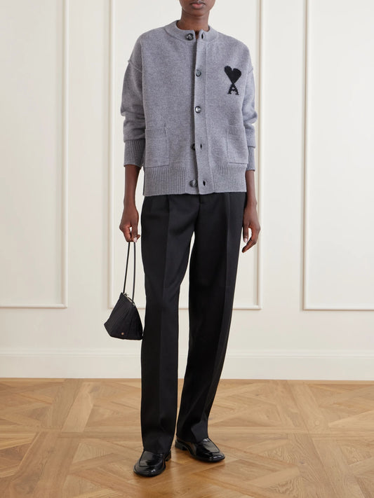 Image of a model wearing Pants. Product name - Pleated Wool-gabardine Wide-leg Pants in Black colour by brand - AMI PARIS