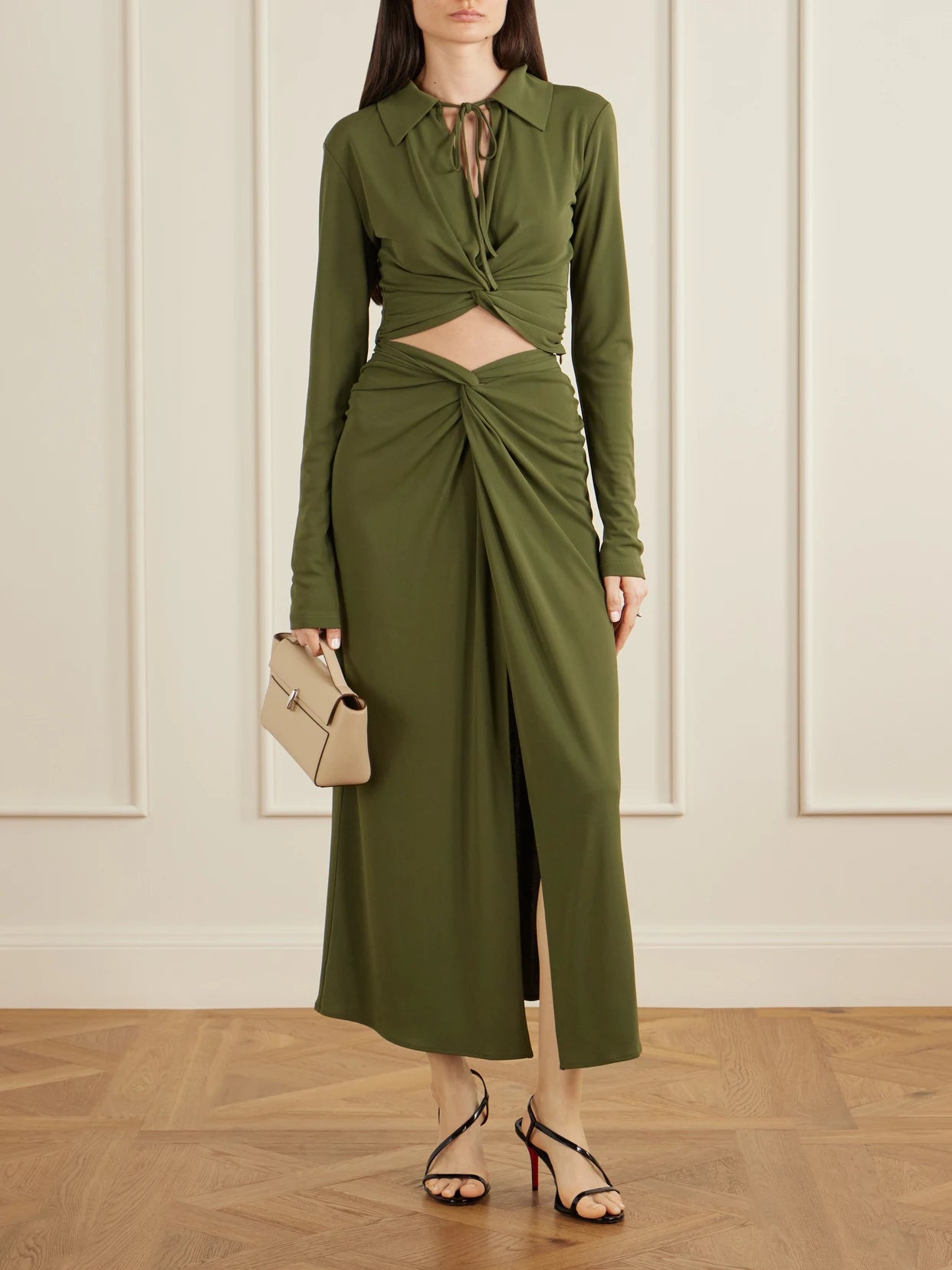 Image of a model wearing Tops. Product name - Gathered Knotted Cropped Top in Army green colour by brand - VIOLANTE NESSI