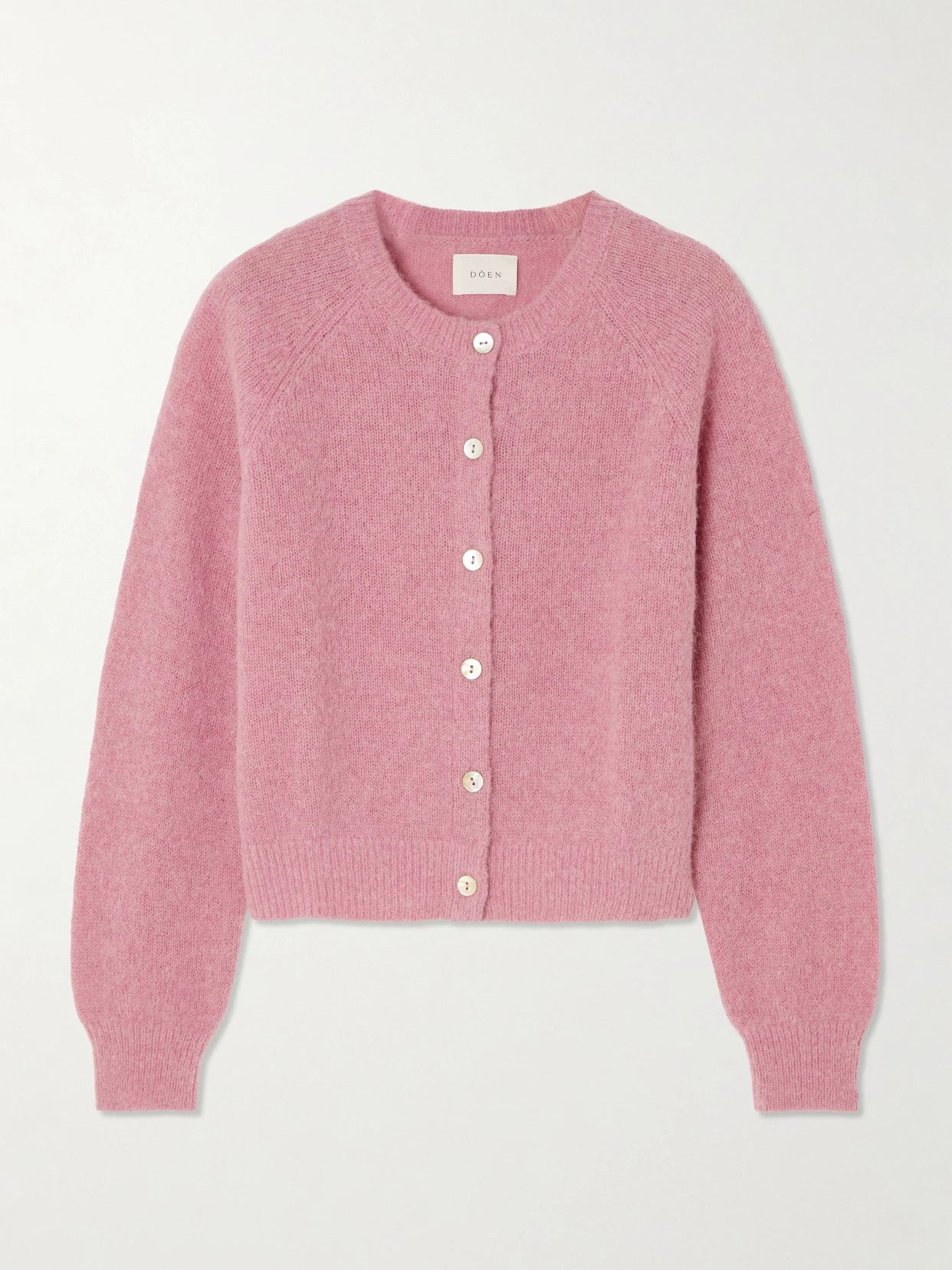 Image of a model wearing Outerwear. Product name - Petra Knitted Cardigan in Pink colour by brand - DÔEN