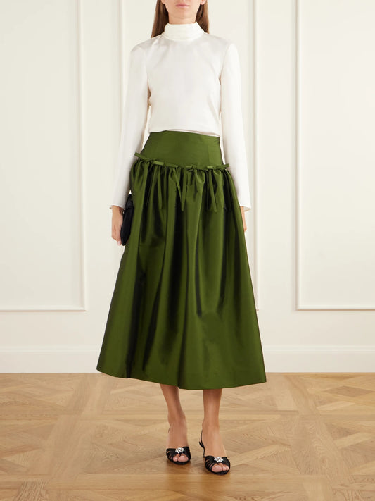 Image of a model wearing Skirts. Product name - Oscar Bow-detailed Gathered Taffeta Midi Skirt in Green, Navy colour by brand - BERNADETTE