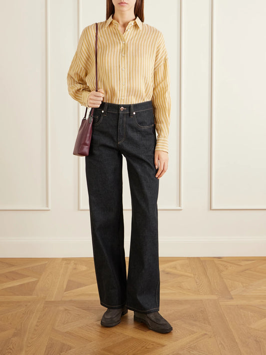 Image of a model wearing Tops. Product name - Bead-embellished Striped Linen And Silk-blend Shirt in Mustard colour by brand - Brunello Cucinelli