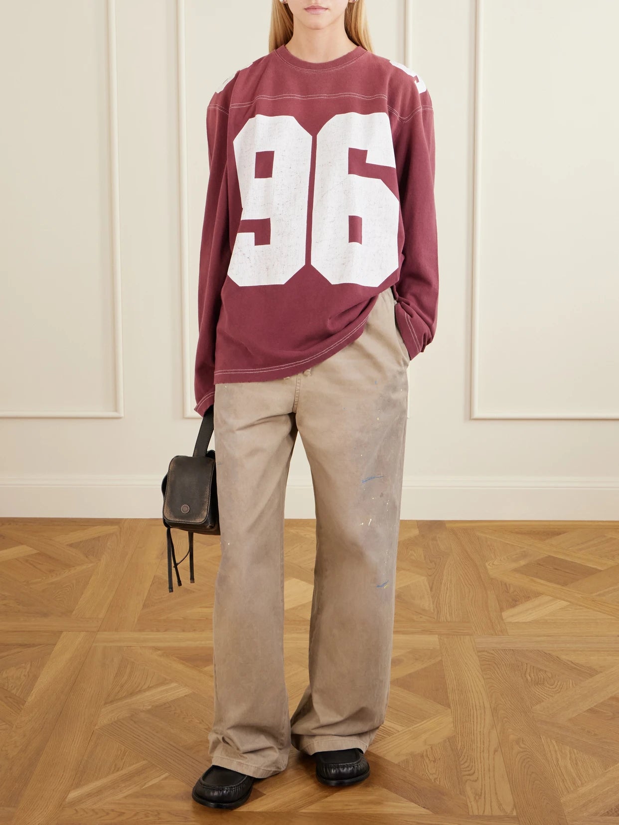 Image of a model wearing Pants. Product name - Plott Paint-splatter Cotton-twill Wide-leg Pants in Beige colour by brand - Acne Studios