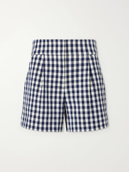 Image of a model wearing Shorts. Product name - Haina Pleated Checked Stretch-cotton Cloqué Shorts in Navy colour by brand - Veronica Beard