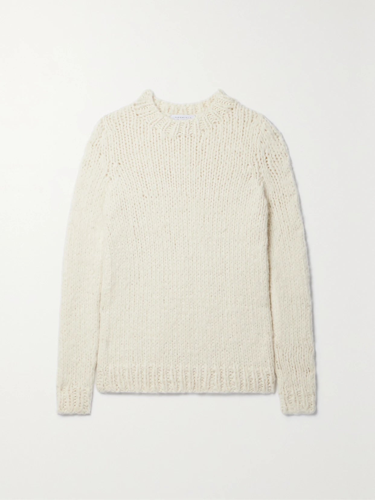 Image of a model wearing Outerwear. Product name - Lawrence Cashmere Sweater in Ivory colour by brand - Gabriela Hearst