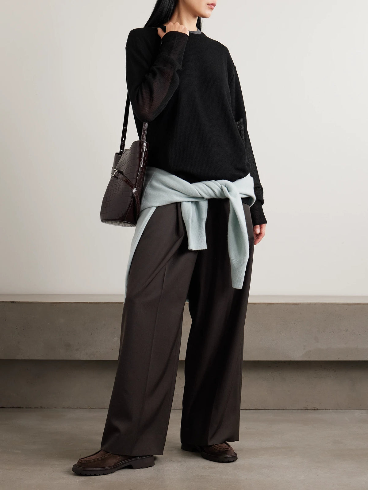 Image of a model wearing Outerwear. Product name - Knitted Sweater in Black colour by brand - ssstein