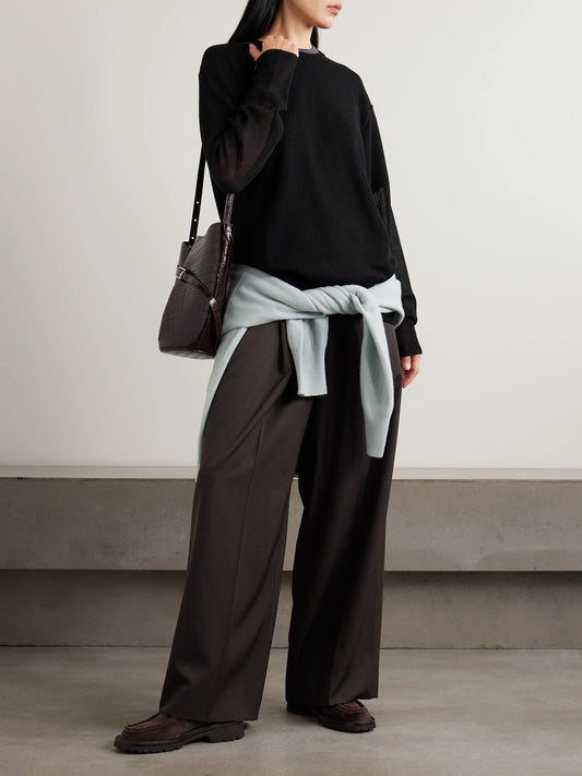 Image of a model wearing Outerwear. Product name - Knitted Sweater in Black colour by brand - ssstein