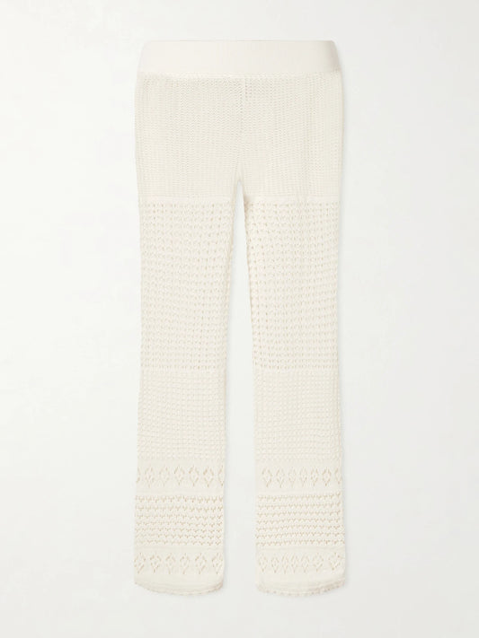 Image of a model wearing Pants. Product name - Embleme Crochet-knit Straight-leg Pants in Ecru colour by brand - Eres