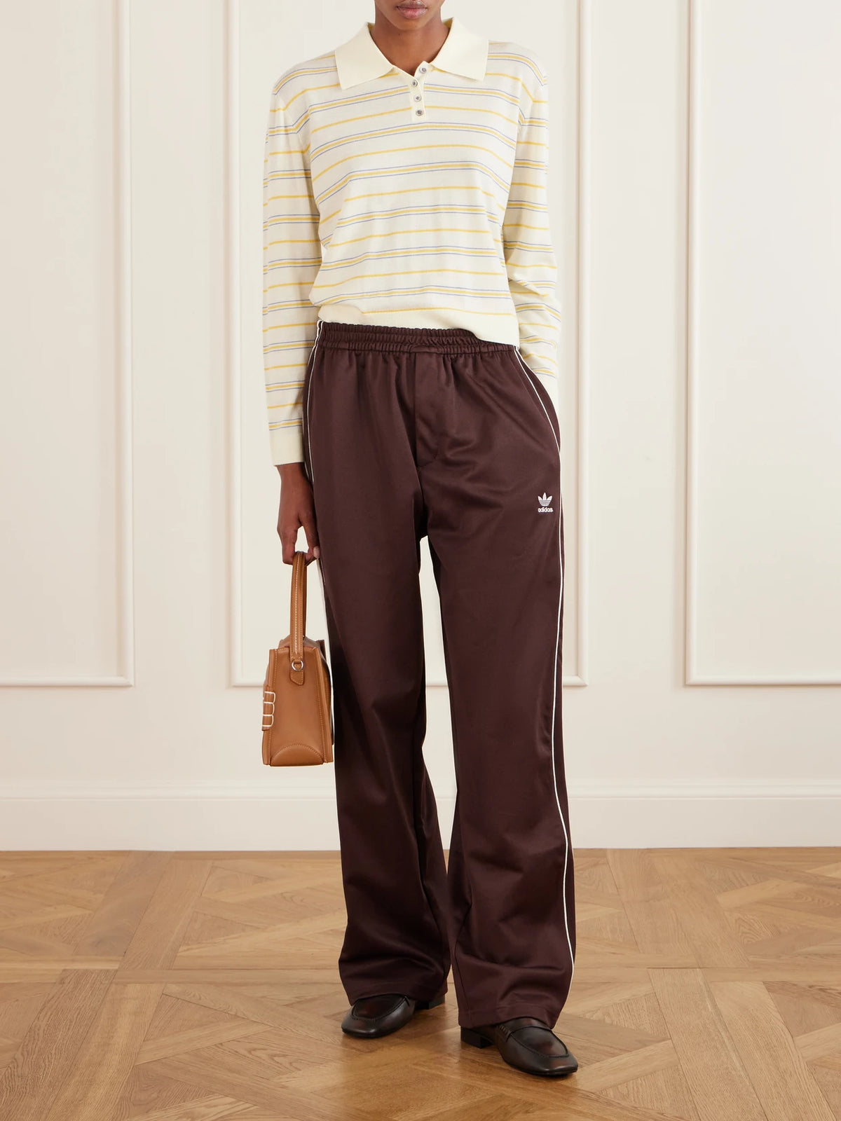 Image of a model wearing Tops. Product name - + Wales Bonner Webbing-trimmed Cotton-blend Jersey Wide-leg Pants in Brown colour by brand - adidas Originals