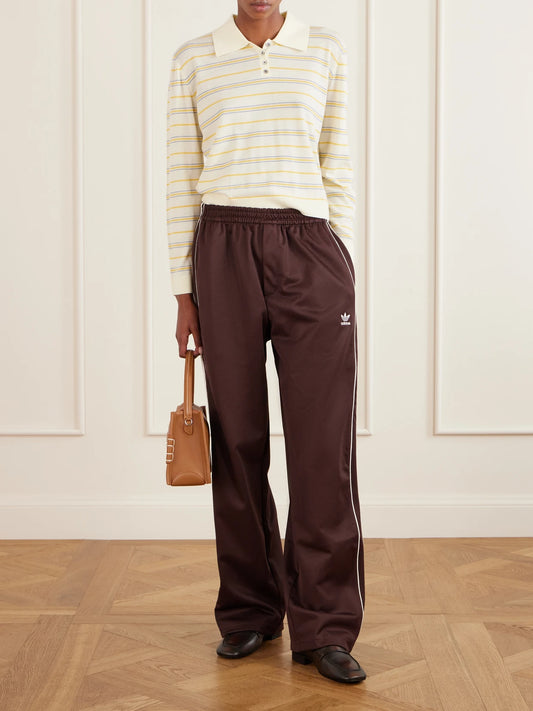 Image of a model wearing Tops. Product name - + Wales Bonner Webbing-trimmed Cotton-blend Jersey Wide-leg Pants in Brown colour by brand - adidas Originals