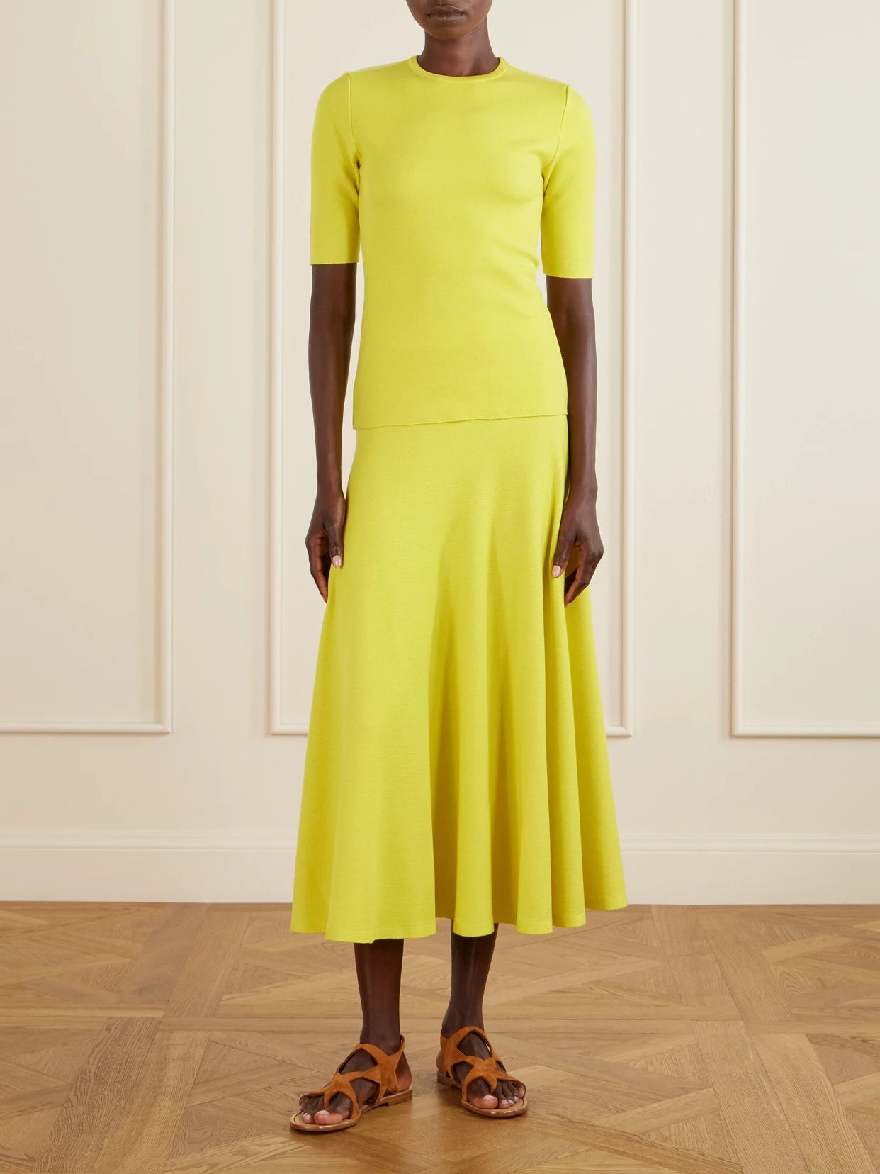 Image of a model wearing Outerwear. Product name - Axis Wool Knitwear in Bright yellow colour by brand - Gabriela Hearst
