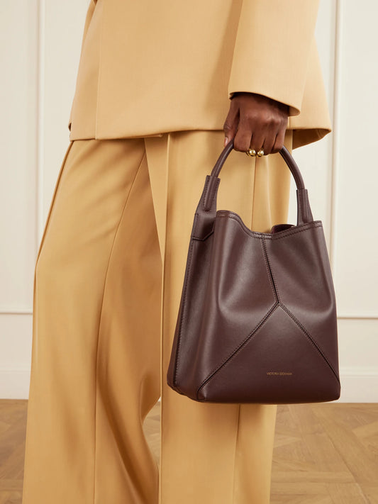 Image of Bags. Product name - The Victoria Bucket Leather Bag in Burgundy colour by brand - Victoria Beckham
