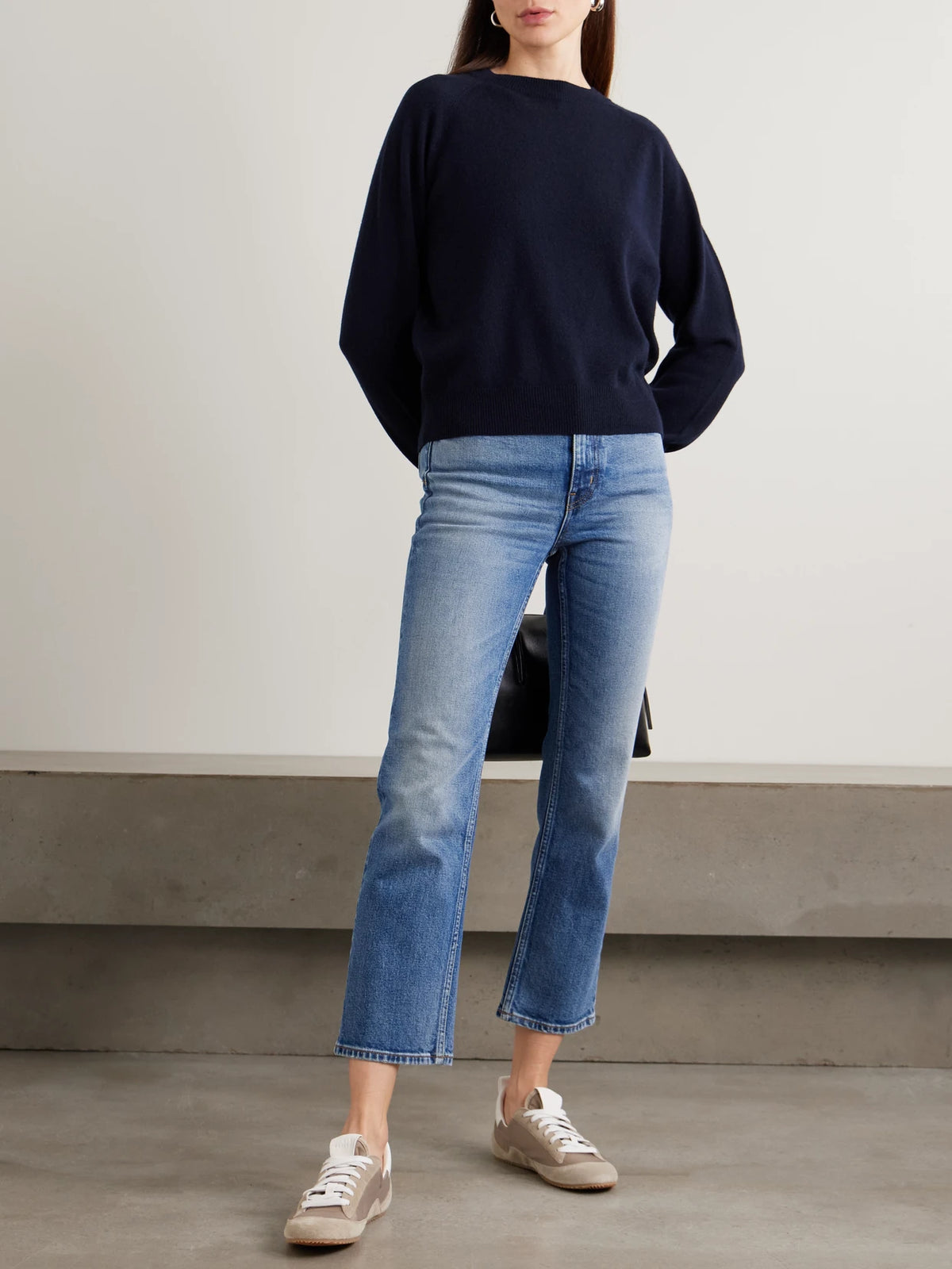 Image of a model wearing Outerwear. Product name - Cashmere Sweater in Navy colour by brand - Jamie Haller