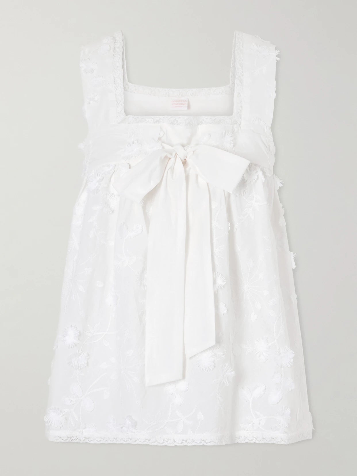 Image of a model wearing Tops. Product name - Suvereto Bow-embellished Lace-trimmed Broderie Anglaise Cotton Top in White colour by brand - Loretta Caponi