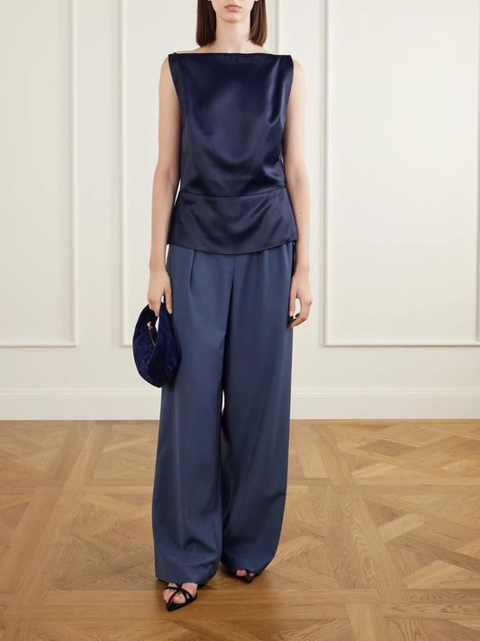 Image of a model wearing Tops. Product name - Paneled Satin Tank in Navy colour by brand - Co