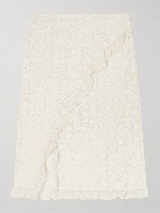 Image of a model wearing Skirts. Product name - Aurella Ruffled Embroidered Mesh Midi Skirt in Ecru colour by brand - DÔEN