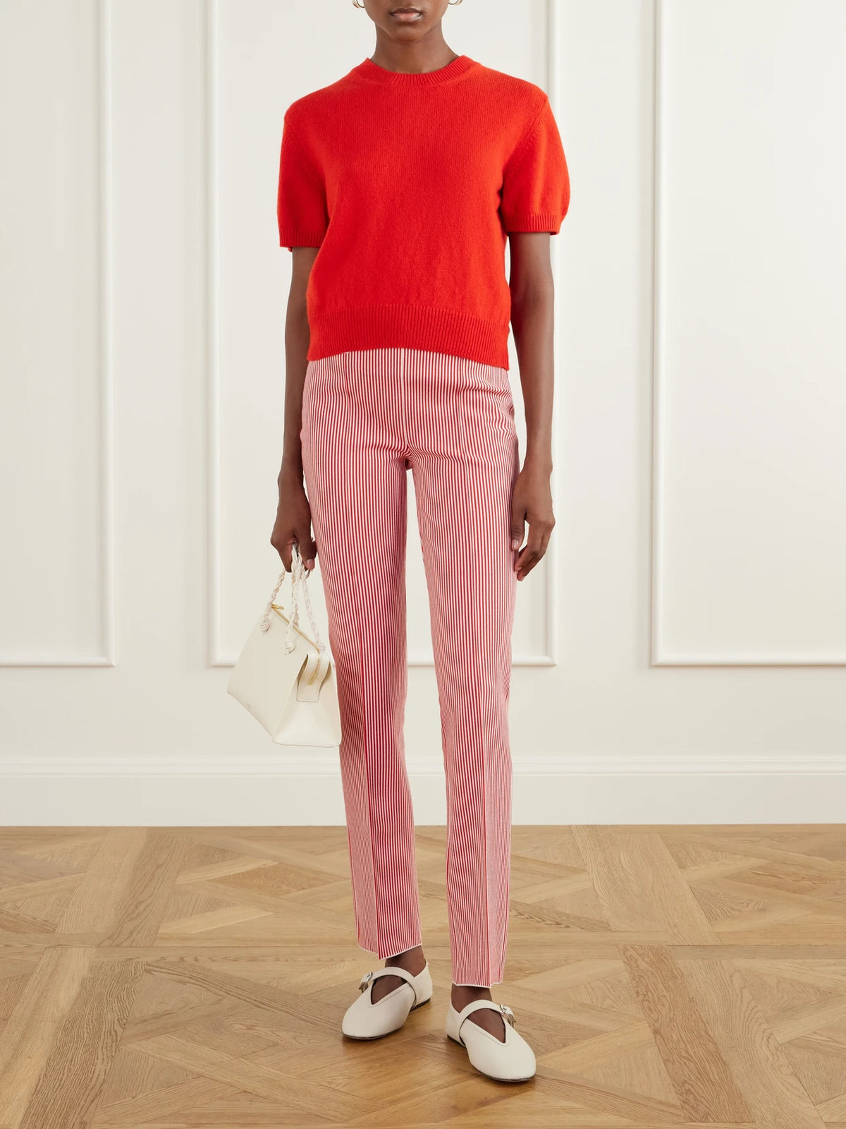 Image of a model wearing Pants. Product name - Luke Striped Cotton-blend Straight-leg Pants in Red colour by brand - HIGH SPORT