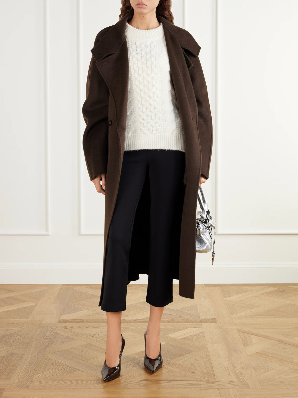 Image of a model wearing Pants. Product name - Scuba Stretch Slim-fit Pants in Black colour by brand - Suzie Kondi