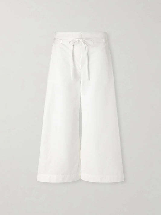 Image of a model wearing Shorts. Product name - Le Marin High-rise Cotton-poplin Wide-leg Shorts in White colour by brand - Jacquemus