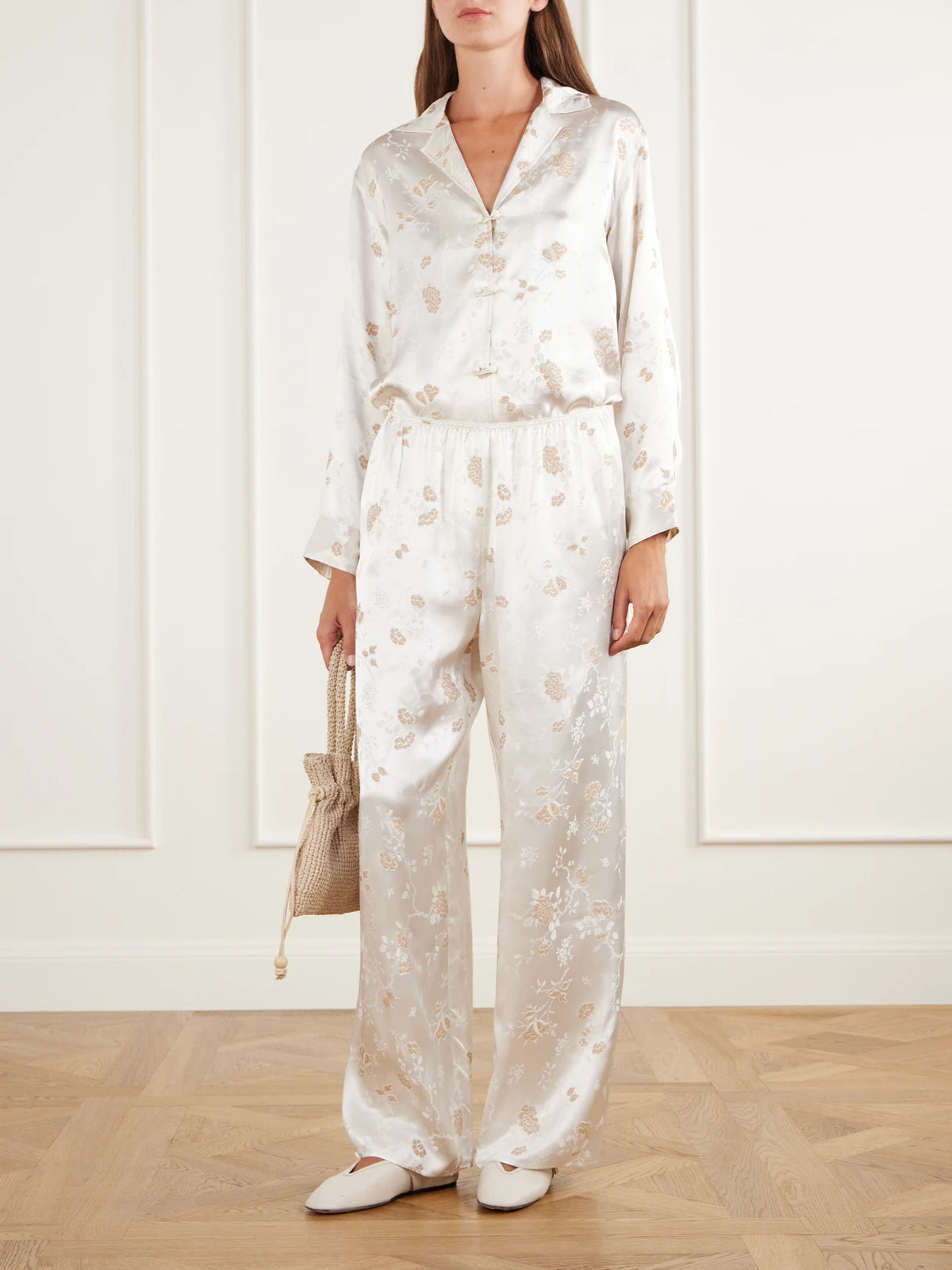 Image of a model wearing Tops. Product name - Maurise Floral-jacquard Shirt in Off-white colour by brand - DÔEN