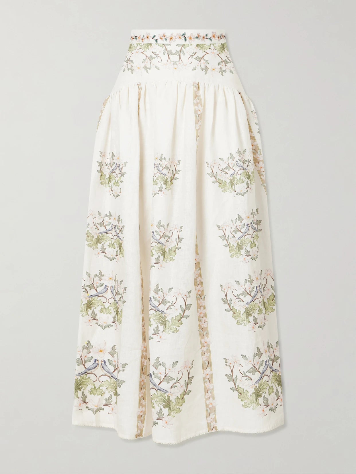 Image of a model wearing Skirts. Product name - Curua Anhelo Floral Linen Midi Skirt in Cream colour by brand - Agua by Agua Bendita