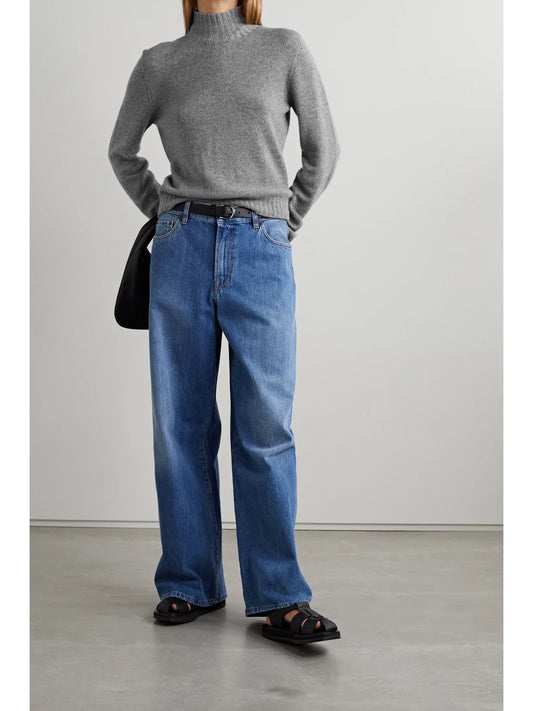 Image of a model wearing Outerwear. Product name - Essentials Kensington Cashmere Turtleneck Sweater in Gray colour by brand - The Row