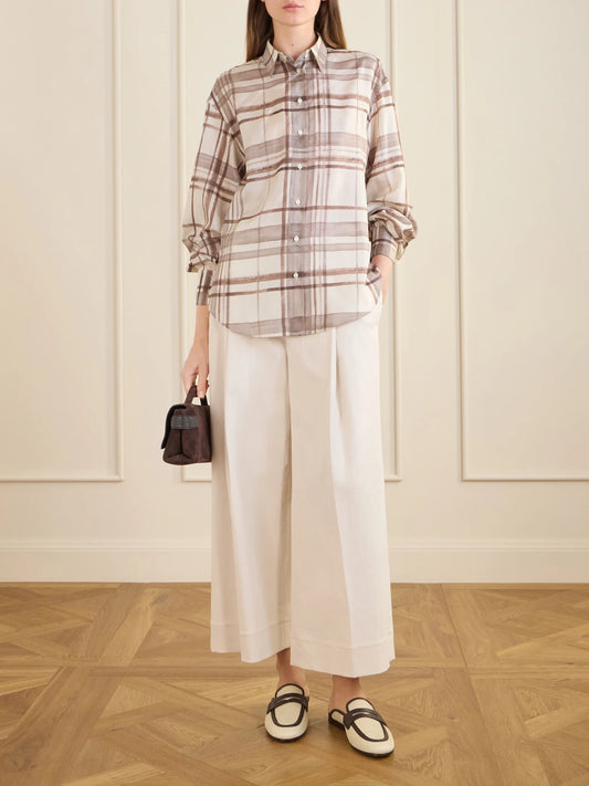 Image of a model wearing Pants. Product name - Cotton-blend Wide-leg Pants in Cream colour by brand - Brunello Cucinelli
