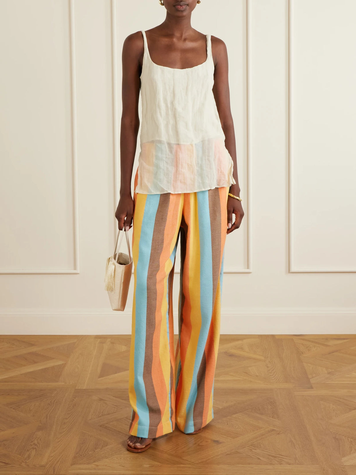 Image of a model wearing Pants. Product name - The Palazzo Striped Cotton-blend Straight-leg Pants in Orange colour by brand - Marrakshi Life