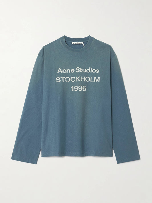 Image of a model wearing Tops. Product name - Printed Organic Cotton And Hemp-blend Jersey T-shirt in Navy colour by brand - Acne Studios