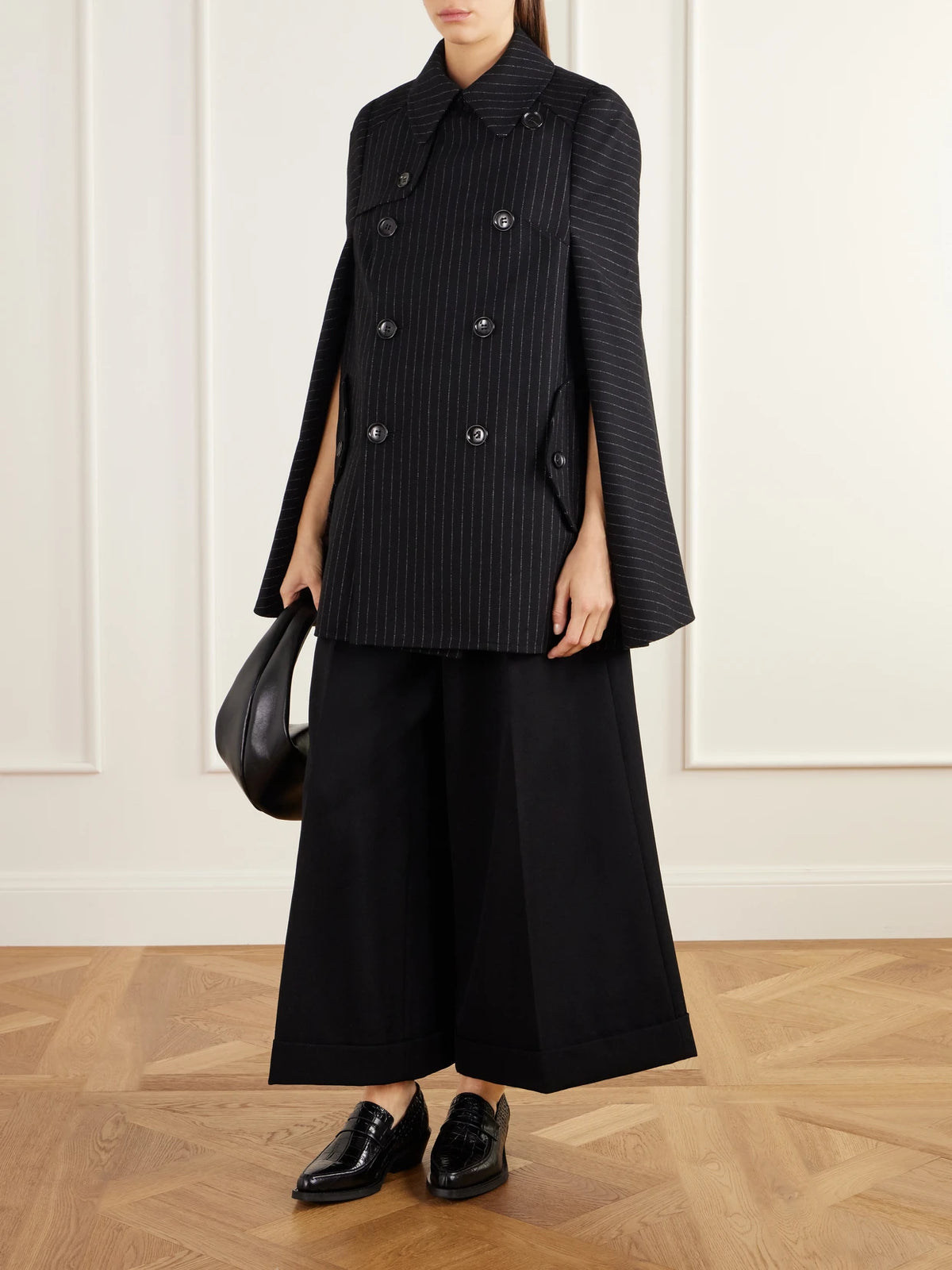 Image of Coats & Jackets. Product name - Pinstriped Wool-blend Twill Cape in Black colour by brand - Junya Watanabe